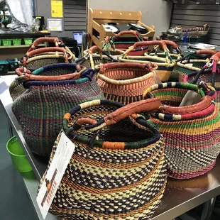 a variety of baskets on display in a store