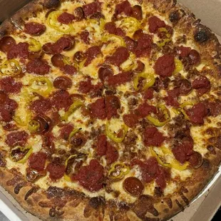 Supreme pizza with banana peppers, pepperoni &amp; half sausage