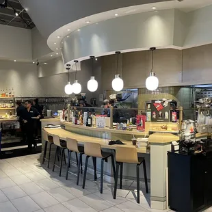 a restaurant with a counter and a bar