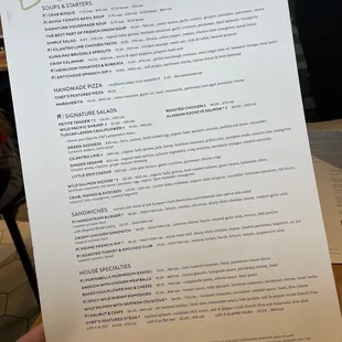 a person holding a menu at a restaurant