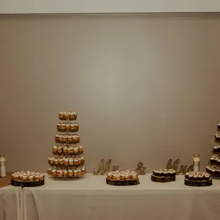a wedding cake and cupcakes