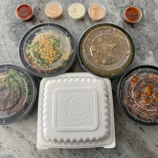 Left to right to go, Unagi Bowl, jap chae, curry chicken , KfC &amp; Tonkatsu in the middle
