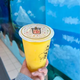  hand holding a cup of iced tea