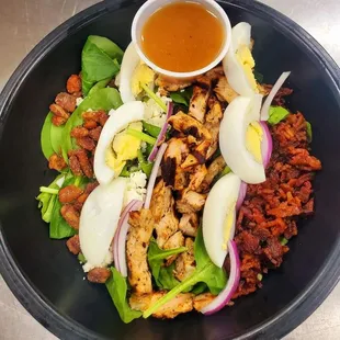 a bowl of salad with hard boiled eggs