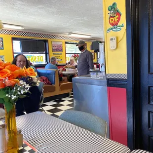 a table with a vase of flowers on it