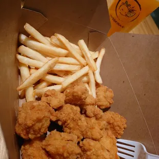 Fries and popcorn chicken snack