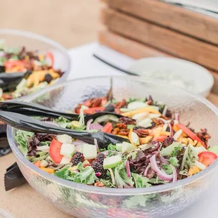two bowls of salad on a table