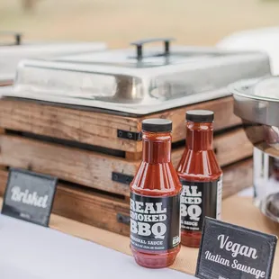 a variety of bbq sauces on a table