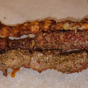 (Front to Back) Lamb, Beef, Pork Belly Skewers