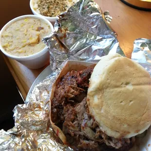 Pulled pork sandwich with mac and cheese and corn pudding