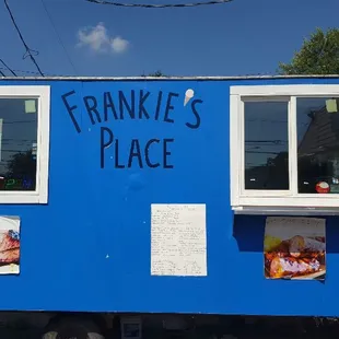 a blue food truck with ice cream cones
