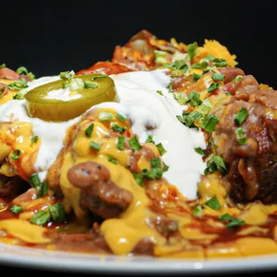 Vegetarian baked potato with slow cooked beans, bbq sauce, 2 cheeses, chives, sour cream &amp; jalapeños.