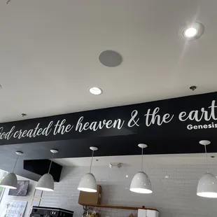 a black and white sign above a counter