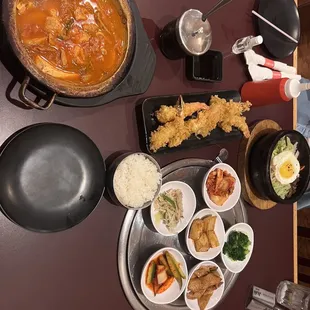 Kimchi Jigae and Hot Stone Bibimbap with Dumpling and shrimp tempura.