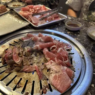 meat being cooked on a grill