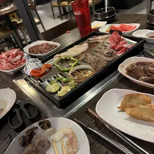 Vegetables, beef Bulgogi, brisket, and pot stickers