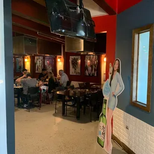 a woman standing in a restaurant