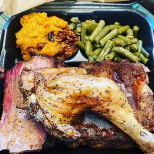 3 meat plate with Chicken, Ribs, and sliced brisket. Sides are green beans and sweet potato casserole.