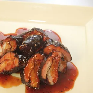 a plate of barbecued meat