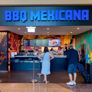 a man and a woman ordering food