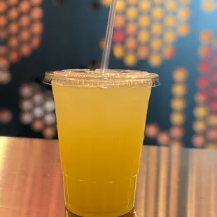 a drink in a plastic cup with a straw