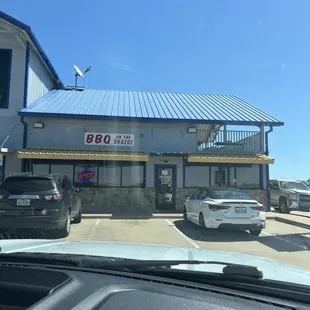 Outside entrance to the right of the gas station.