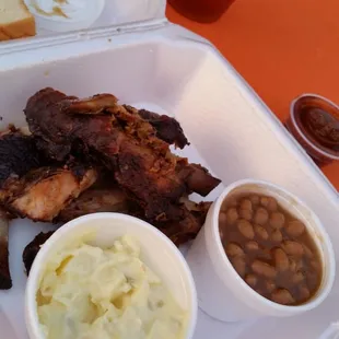 Tommy Q's- ribs, beans, potato salad, and white bread w/ hot sauce