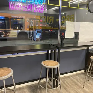 two stools in front of a window