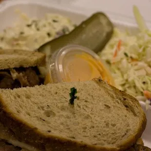 Reuben with Russian dressing and potato salad, and coleslaw
