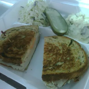 Turkey Melt w/ Russian Dressing (get the dressing).  All of this (sandwich, slaw and potato salad) plus a can of soda for $6.00