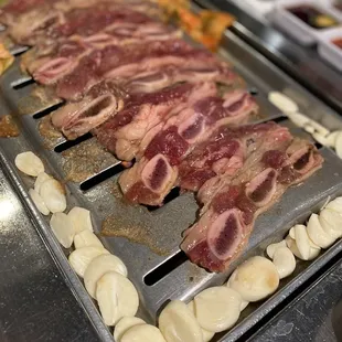 bacon and potatoes on a grill