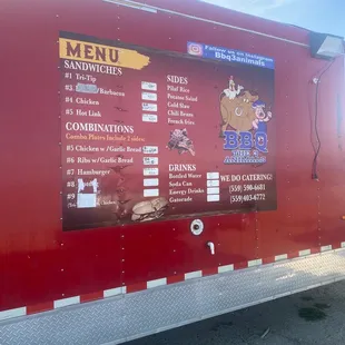 a menu on the side of a food truck