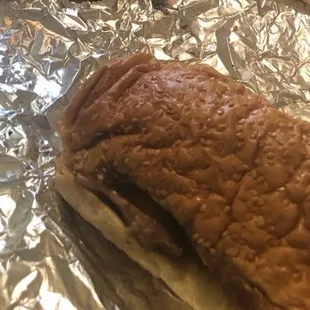 a sandwich wrapped in tin foil