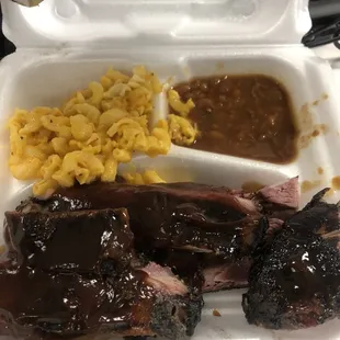ribs and macaroni in a styrofoam container