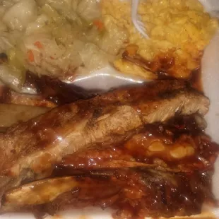 #503 1/2 slab of long pork ribs with mac and cabbage