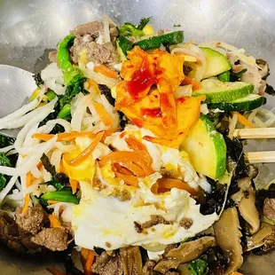 a stir fry with vegetables and meat