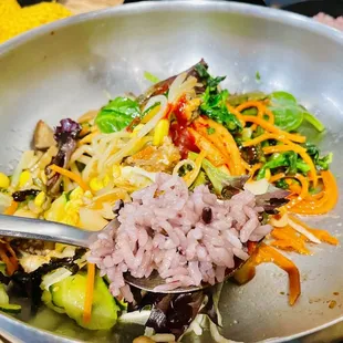 a bowl of rice and vegetables