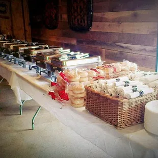 a long table with baskets of food