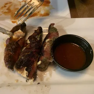 Jalapeño Poppers wrapped in bacon. Yes please!!