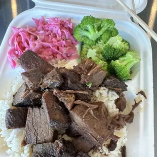 Brisket place, with steamed rice, pickled cabbage salad and broccoli.