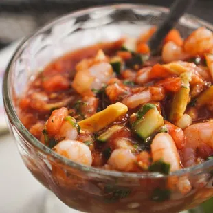 a bowl of shrimp and zucchini