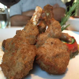 Breaded Baby Lamb Chops, Vegetables "Tumbet" and Aromatic Herb Sabayon