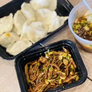 two take out containers of food