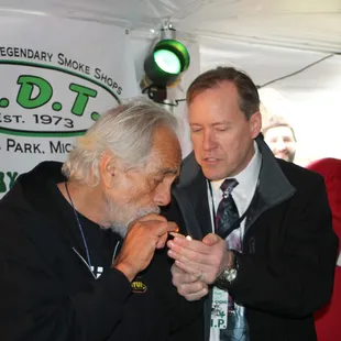 Tommy Chong with Councilman Andrew LeCureaux.  Andy is helping Tommy with a much needed light.