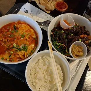 Ddebokki (left) for $1.50 and kalbi rice bowl with multigrain rice,  kale, kimchi, picked cucumber, and gochujang