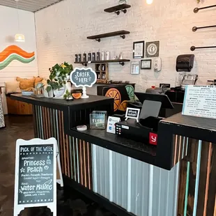 a coffee shop with a chalkboard sign