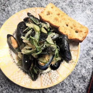 Tarragon mussels with fennel, white wine, and house made focaccia.