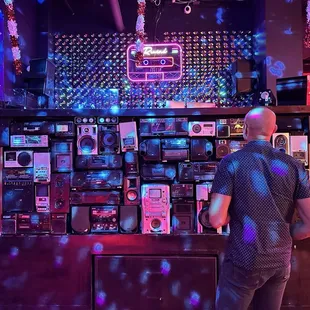Super cool old speakers and boom boxes display.