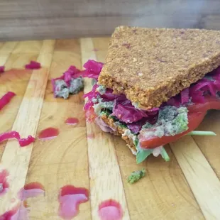 Raw, vegan sandwhich!

Sum dried tomato bread, pesto, kraut amd veggies.