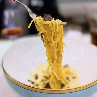 Tajarin Al Tartufo: Hand cut pasta, parmesan fonduta, black périgord truffles | $48